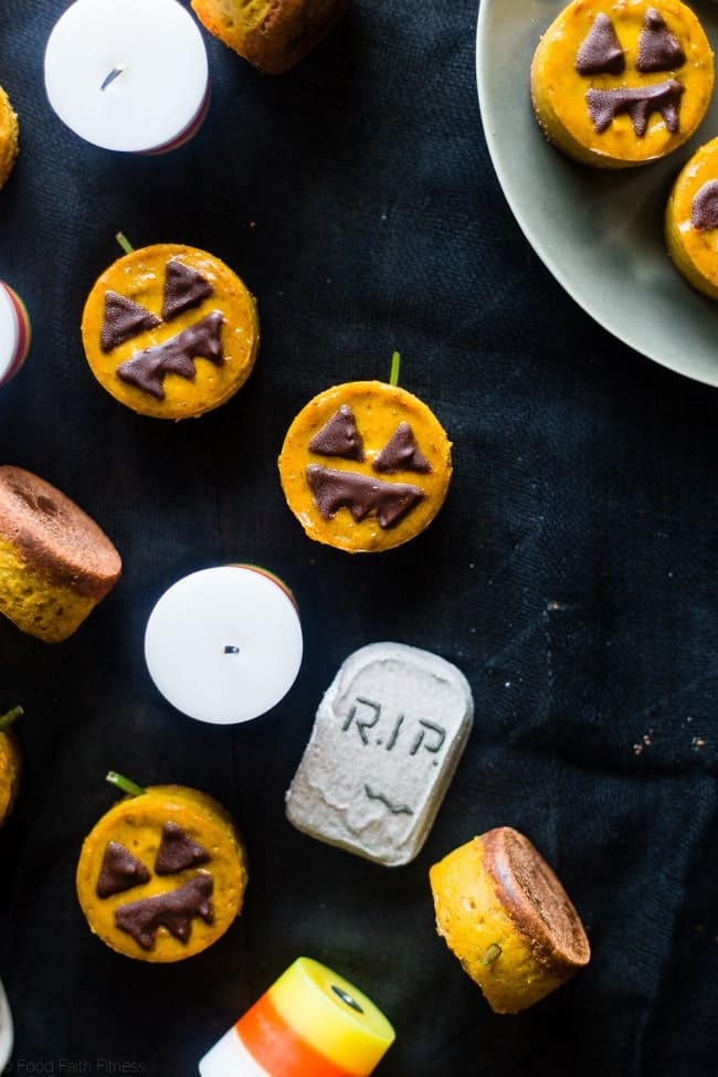 Vegan Mini Pumpkin Jack-O-Lantern Cheesecakes - These pumpkin vegan cheesecakes are easy to make, and are perfect for Halloween! They're healthy, gluten free, paleo friendly and only 200 calories! | Foodfaithfitness.com | @FoodFaithFit