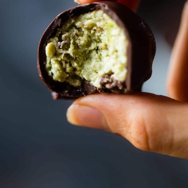 Mint Avocado Cheesecake Truffles - These low carb, protein-packed, creamy cheesecake truffles are covered in chocolate! They're a healthy, gluten free Christmas treat for only 90 calories! | Foodfaithfitness.com | @FoodFaithFit