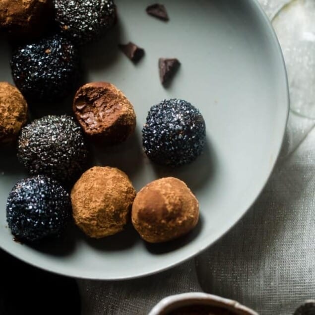 Vegan Champagne Truffles - These 5 ingredient, vegan truffles use a secret, heart-healthy ingredient to make them so creamy and only 60 calories! A little champagne makes them perfect for New years Eve! | Foodfaithfitness.com | @FoodFaithFit