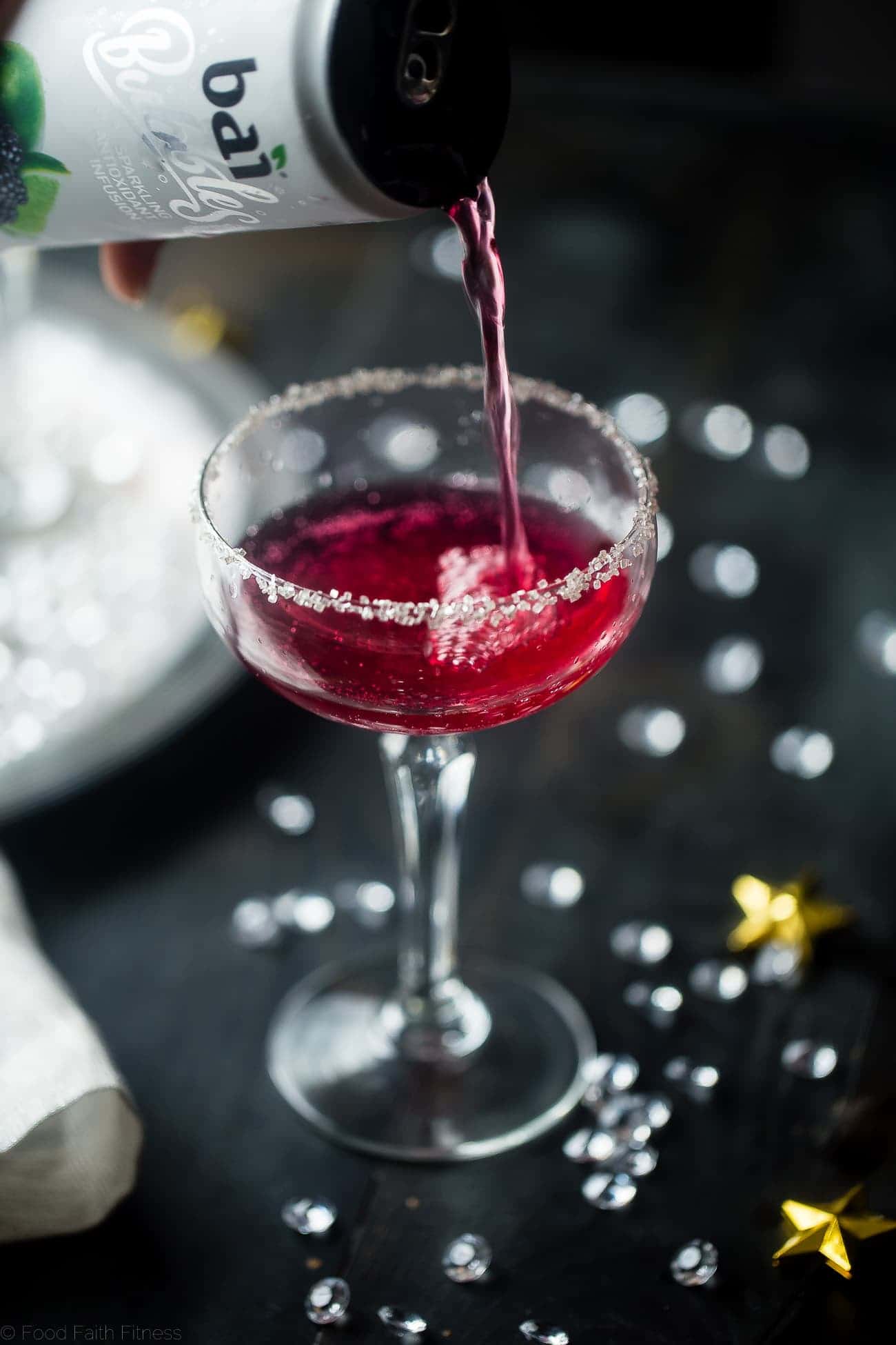 3 Ingredient Skinny Champagne Cocktails - Both of these blackberry raspberry and mango coconut sparkling champagne cocktails are under 150 calories and are naturally sweetened! Perfect for a healthy NYE! | Foodfaithfitness.com | @FoodFaithFit