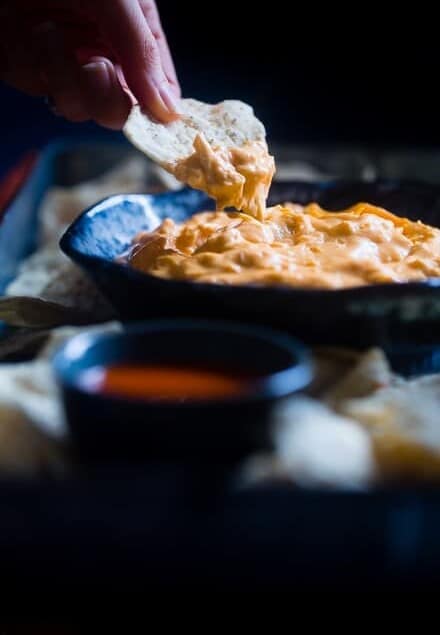 5 Ingredient Crock Pot Buffalo Chicken Dip with Cauliflower - This dip is made with cauliflower so it's packed with hidden veggies and extra creamy! It's a healthy, low carb and gluten free appetizer for game day! | Foodfaithfitness.com | @FoodFaithFit
