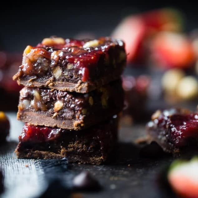 Strawberry Chocolate Paleo Magic Cookie Bars - These magic cookie bars have a sweet strawberry swirl and are SO easy to make! They're a healthy, vegan friendly and gluten free remake of the classic recipe that everyone will love! | Foodfaithfitness.com | @FoodFaithFit