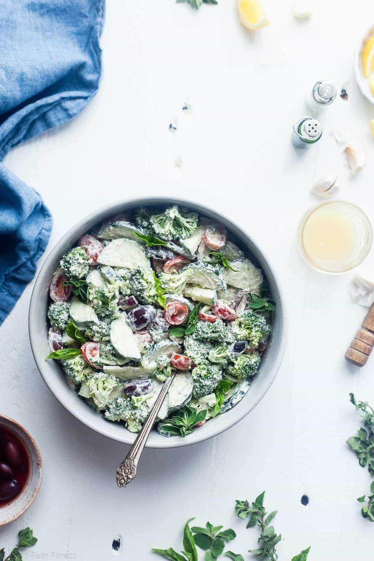 Greek Low Carb Broccoli Salad - This low carb, raw broccoli salad is so creamy you'll never know it's vegan, paleo and whole30 compliant! It's an easy side dish that's perfect for spring potlucks! | Foodfaithfitness.com | @FoodFaithFit