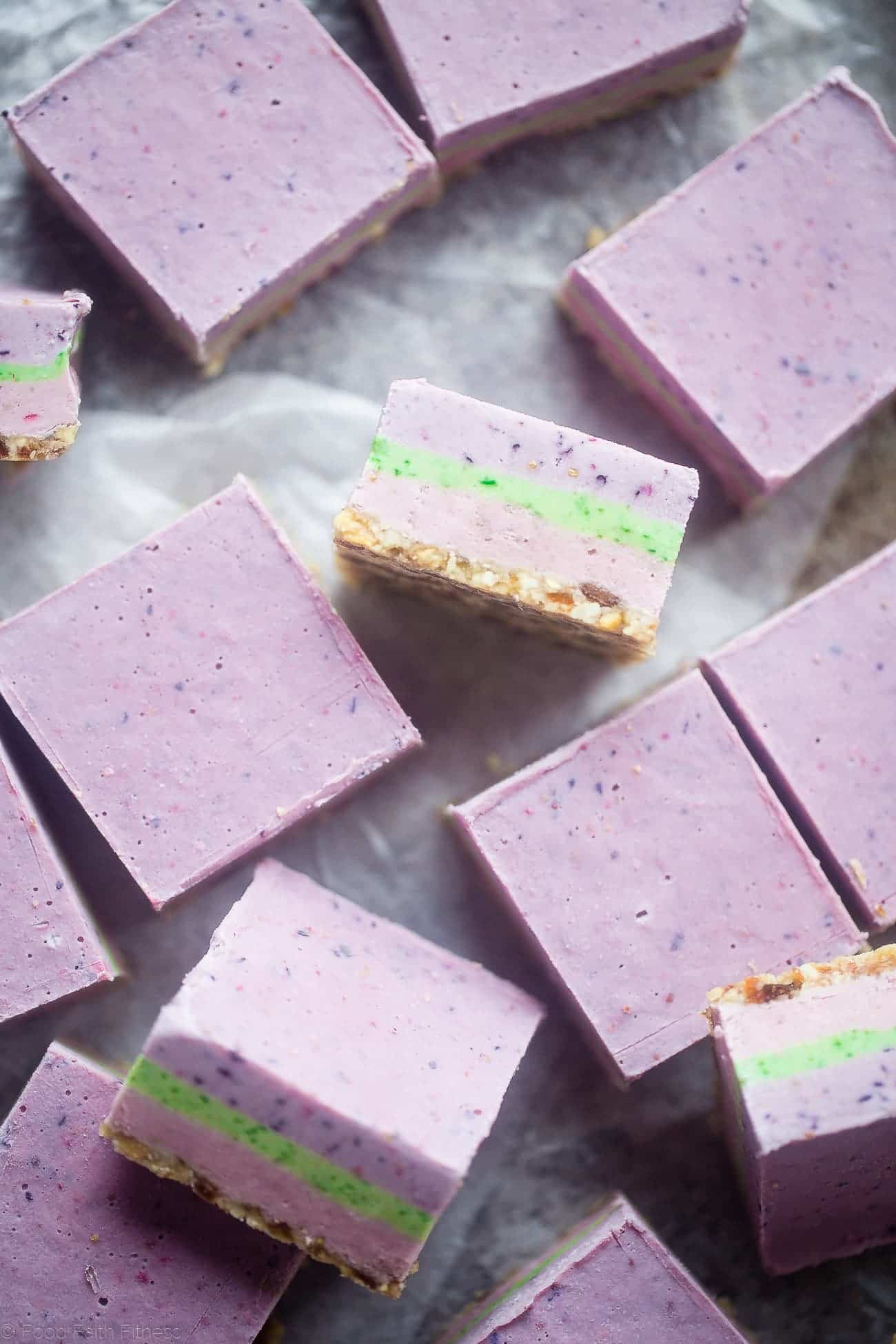 No Bake Superfood Berry Cashew Cream bars - These vegan bars are naturally colored with fruit and vegetables! They're so creamy you'll never know they're healthy and dairy and gluten free! Perfect for Easter! | Foodfaithfitness.com | @FoodFaithFit