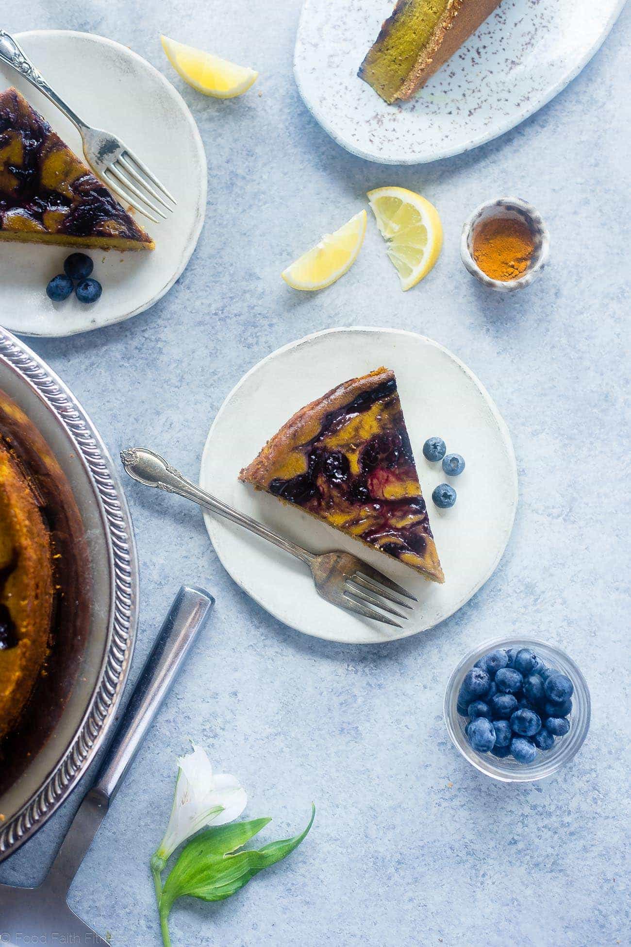 Blueberry Lemon Turmeric Vegan Cheesecake - This easy, paleo friendly cheesecake is made from cashews and has a blueberry swirl! It's so creamy you'll never know it's dairy, grain and gluten free! | Foodfaithfitness.com | @FoodFaithFit