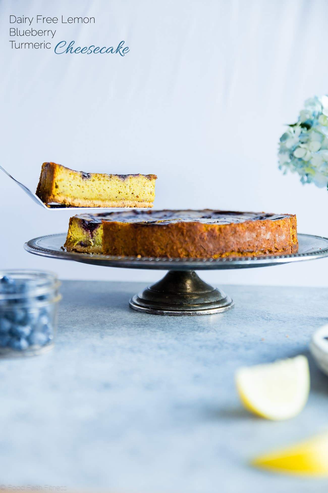 Blueberry Lemon Turmeric Vegan Cheesecake - This easy, paleo friendly cheesecake is made from cashews and has a blueberry swirl! It's so creamy you'll never know it's dairy, grain and gluten free! | Foodfaithfitness.com | @FoodFaithFit