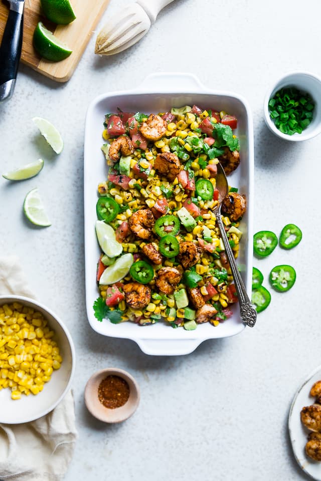 Healthy Honey Lime Grilled Mexican Corn Salad with Shrimp - This quick and easy, gluten free salad is tossed with juicy, smoky shrimp and has a sweet and tangy honey lime vinaigrette! Perfect for summer cook outs! | Foodfaithfitness.com | @FoodFaithFit