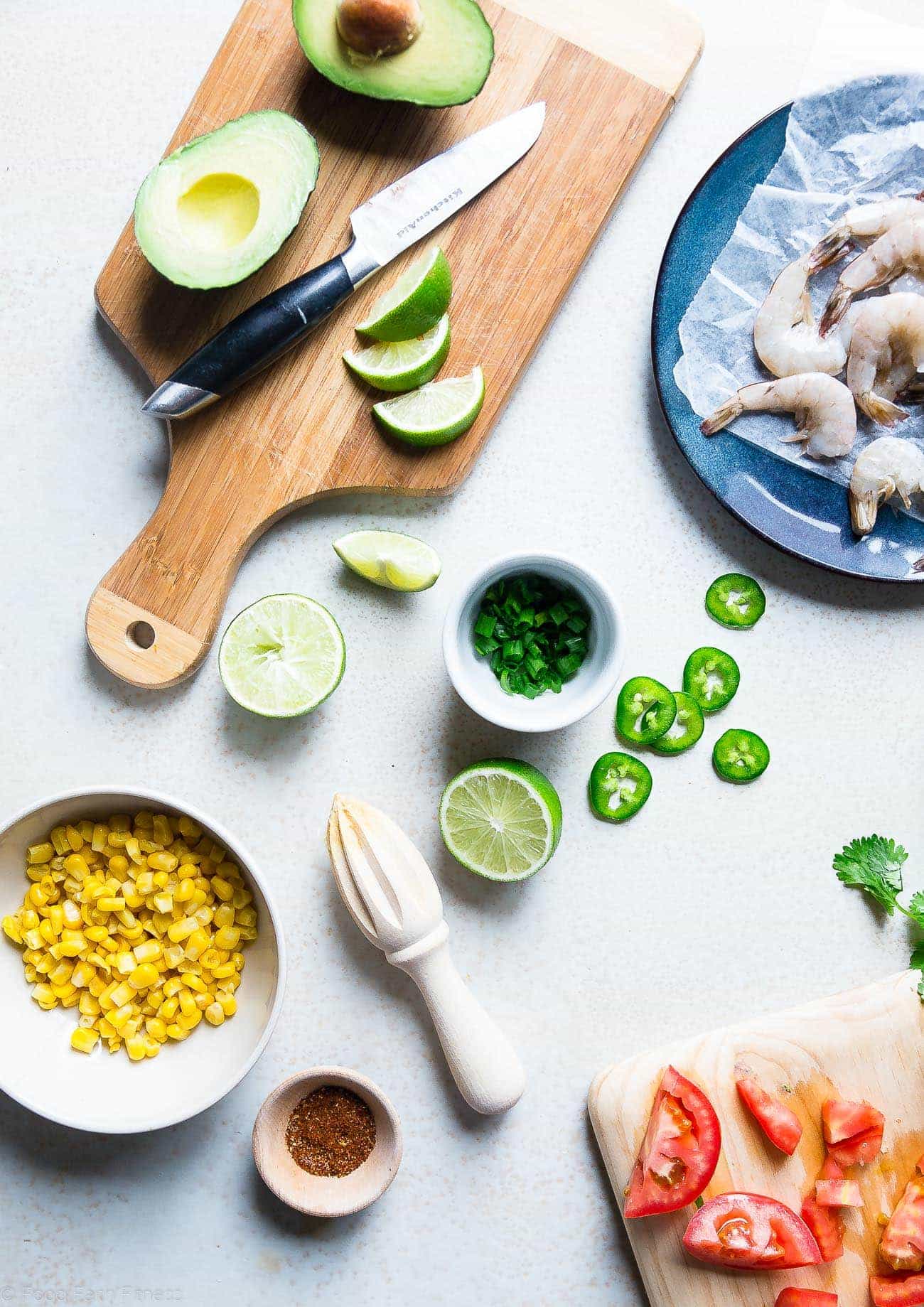 Healthy Honey Lime Grilled Mexican Corn Salad with Shrimp - This quick and easy, gluten free salad is tossed with juicy, smoky shrimp and has a sweet and tangy honey lime vinaigrette! Perfect for summer cook outs! | Foodfaithfitness.com | @FoodFaithFit