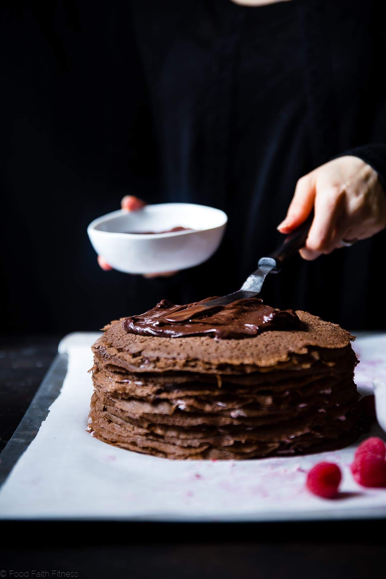 Raspberry Chocolate Vegan Crepe Cake - These crepe cake is made of chocolate crepes layered with raspberries and creamy coconut! It's an impressive healthier, gluten and dairy free dessert that everyone will love! | Foodfaithfitness.com | @FoodFaithFit