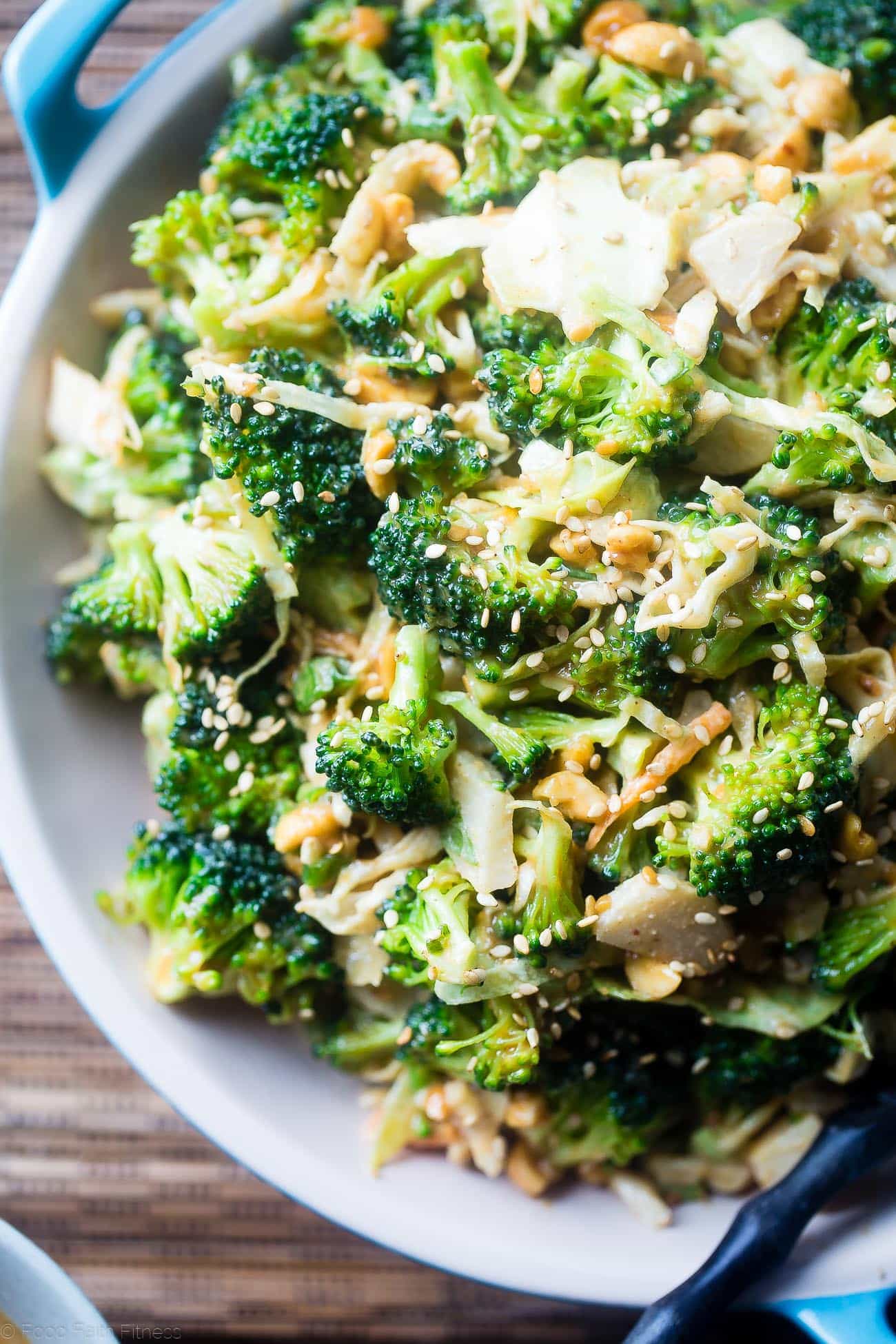 Asian Healthy Broccoli Salad - This crowd-pleasing healthy broccoli salad is a no-cook side dish, loaded with creamy peanut sauce! It's quick and easy, gluten free and vegan with a paleo option! | Foodfaithfitness.com | @FoodFaithFit