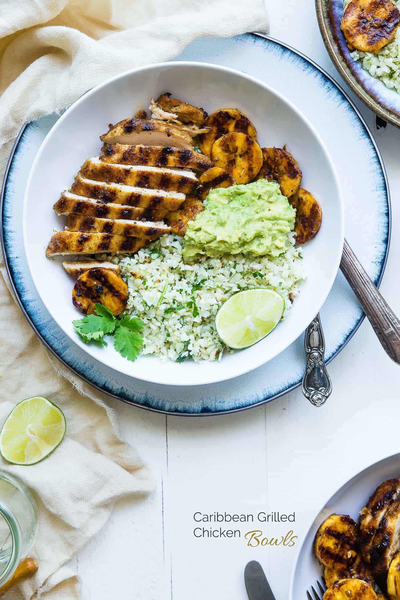 Caribbean Chicken Bowls - These paleo-friendly bowls have grilled plantains, cauliflower rice and avocado! A healthy, gluten free summer meal for under 500 calories! | #Foodfaithfitness | #Paleo #Glutenfree #Healthy #chickenrecipe