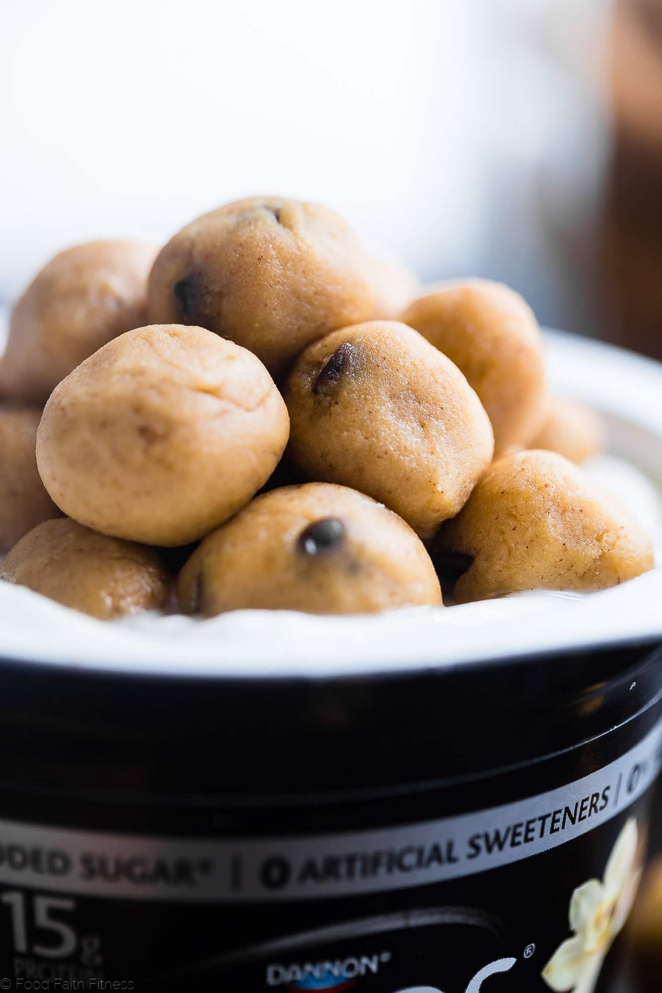 Close up of cookie dough balls on yogurt cup. Recipe on Foodfaithfitness.com