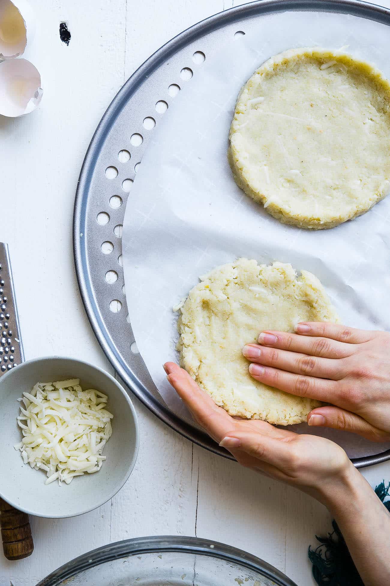 Forming cauliflower into pizza crusts. Recipe on Foodfaithfitness.com