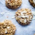 White chocolate drizzled onto no bake white chocolate macadamia nut cookies. Recipe on Foodfaithfitness.com