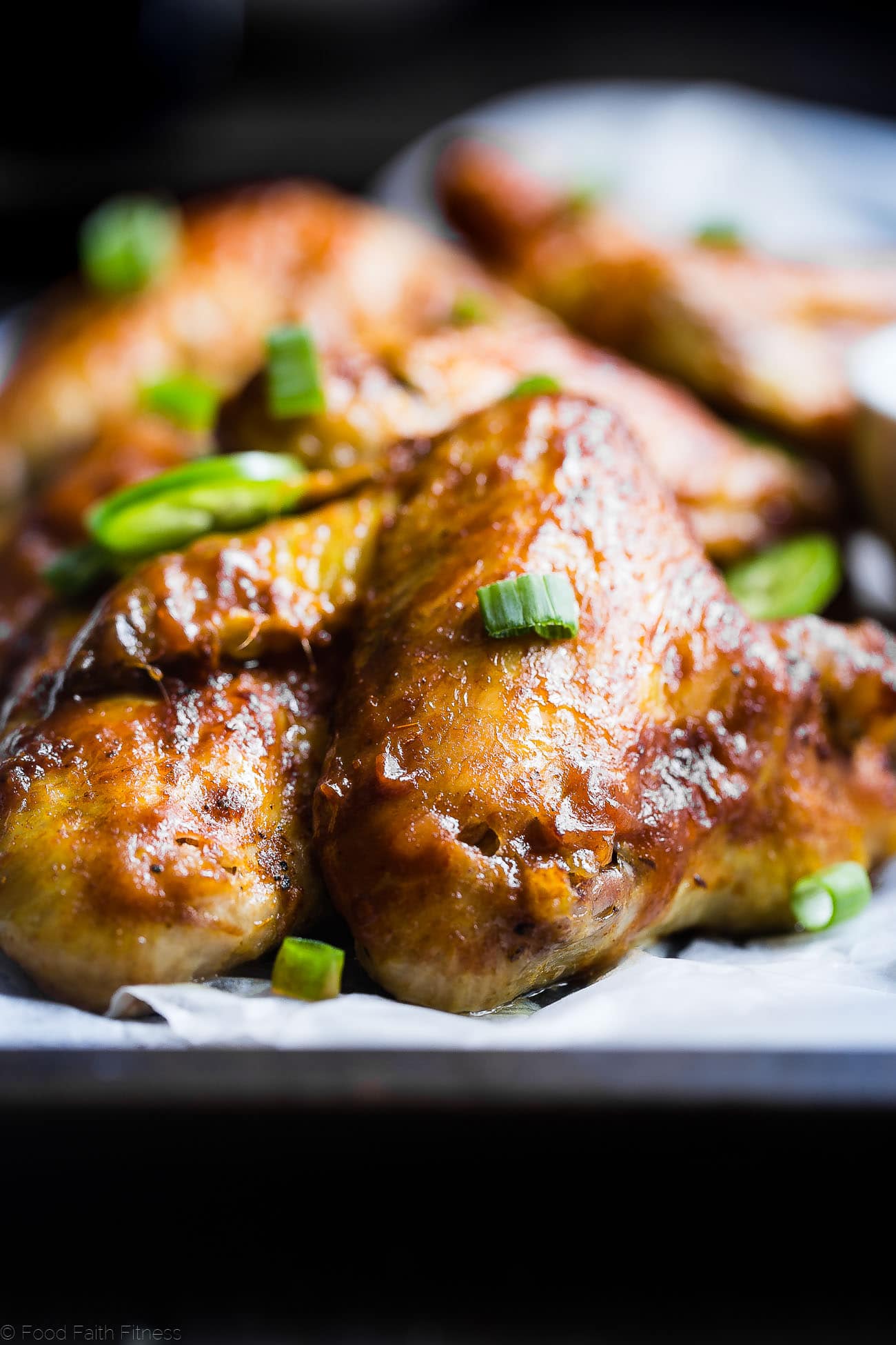Slow Cooker BBQ Chicken Wings - Let the slow cooker do the work for you with these easy paleo-friendly chicken wings! A healthy, gluten, grain and dairy free, crowd pleasing appetizer for game day! | Foodfaithfitness.com | @FoodFaithFit