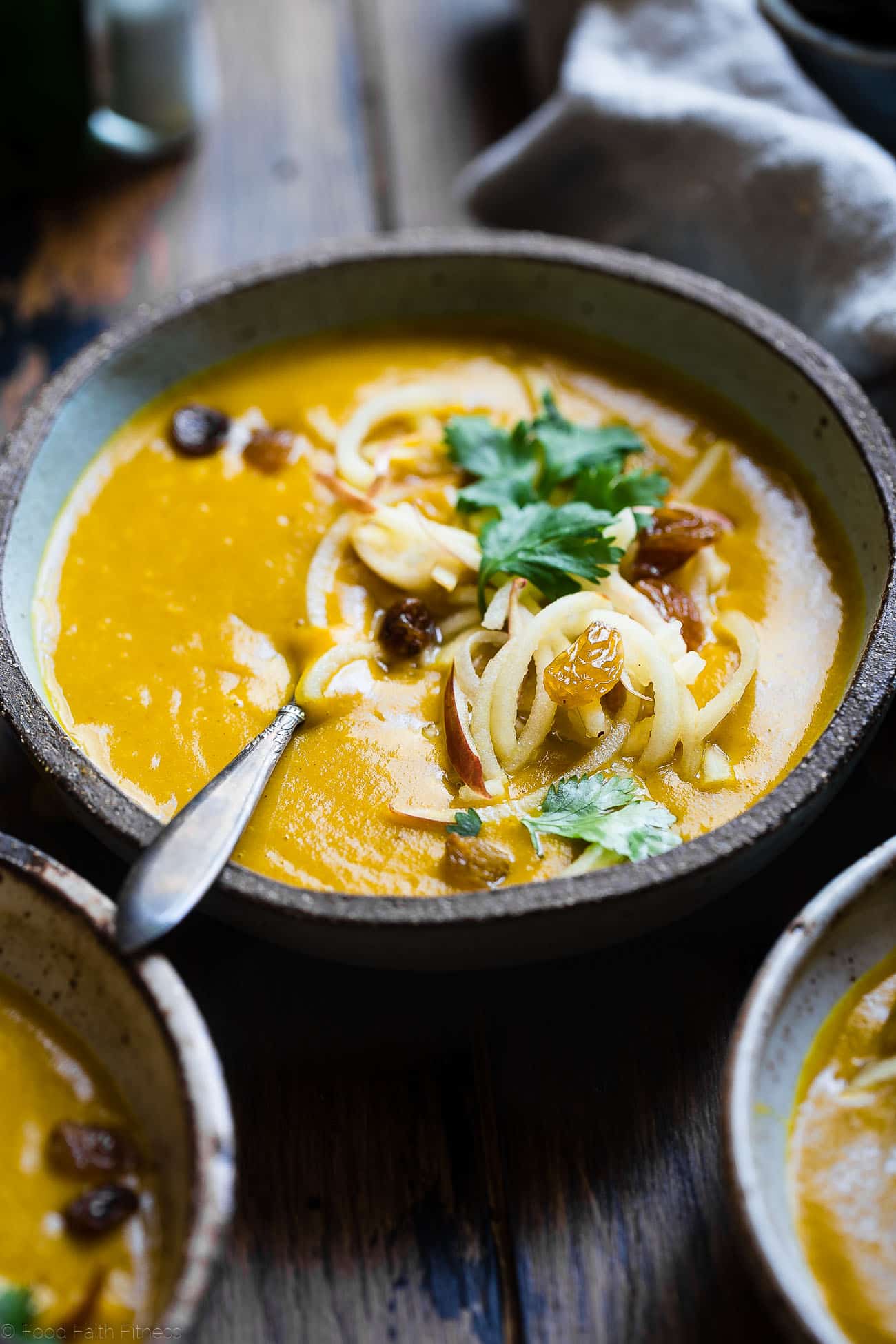 Slow Cooker Apple, Turmeric and Kabocha Squash Soup -  Let the slow cooker do the work for you with this anti-inflammatory paleo, vegan and whole30 compliant kabocha squash soup! It's an easy, healthy and gluten free fall meal! | Foodfaithfitness.com | @FoodFaithFit
