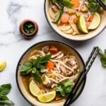 two bowls of Chicken Pho Recipe on a table
