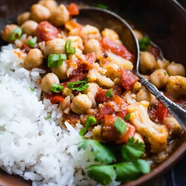 Instant Pot Vegan Chickpea Curry - This easy chickpea curry is made in the Instant Pot and ready in 20 mins! It uses coconut milk and tomatoes to make it thick and so creamy! Makes great leftovers and is great for meal prep! | Foodfaithfitness.com | @FoodFaithFit