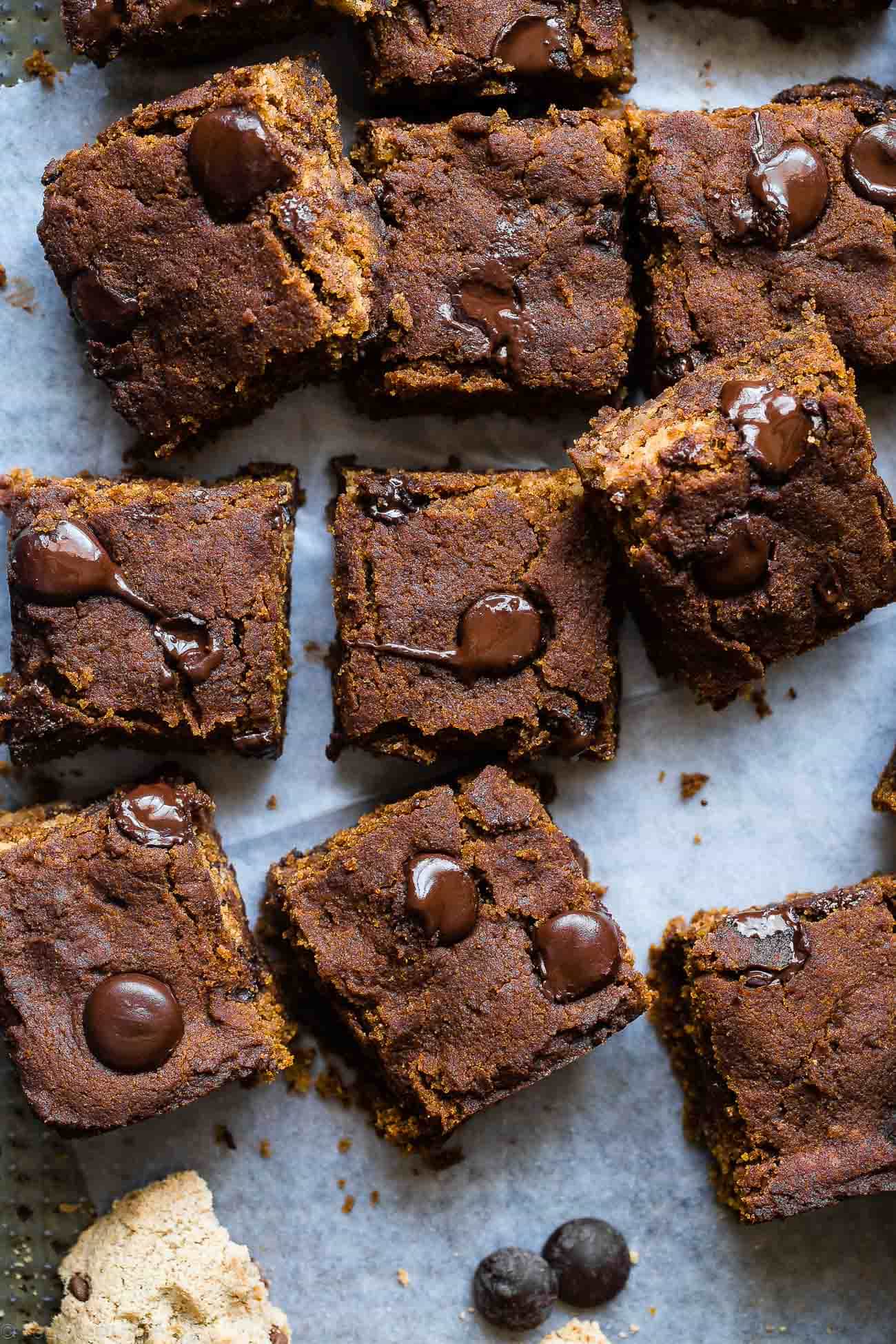 Cookie Stuffed Chewy Pumpkin Blondies - Cookies are baked right inside these healthier pumpkin brookies! They're so dense and chewy you'll never know they're gluten and dairy free! | Foodfaithfitness.com | @FoodFaithFit