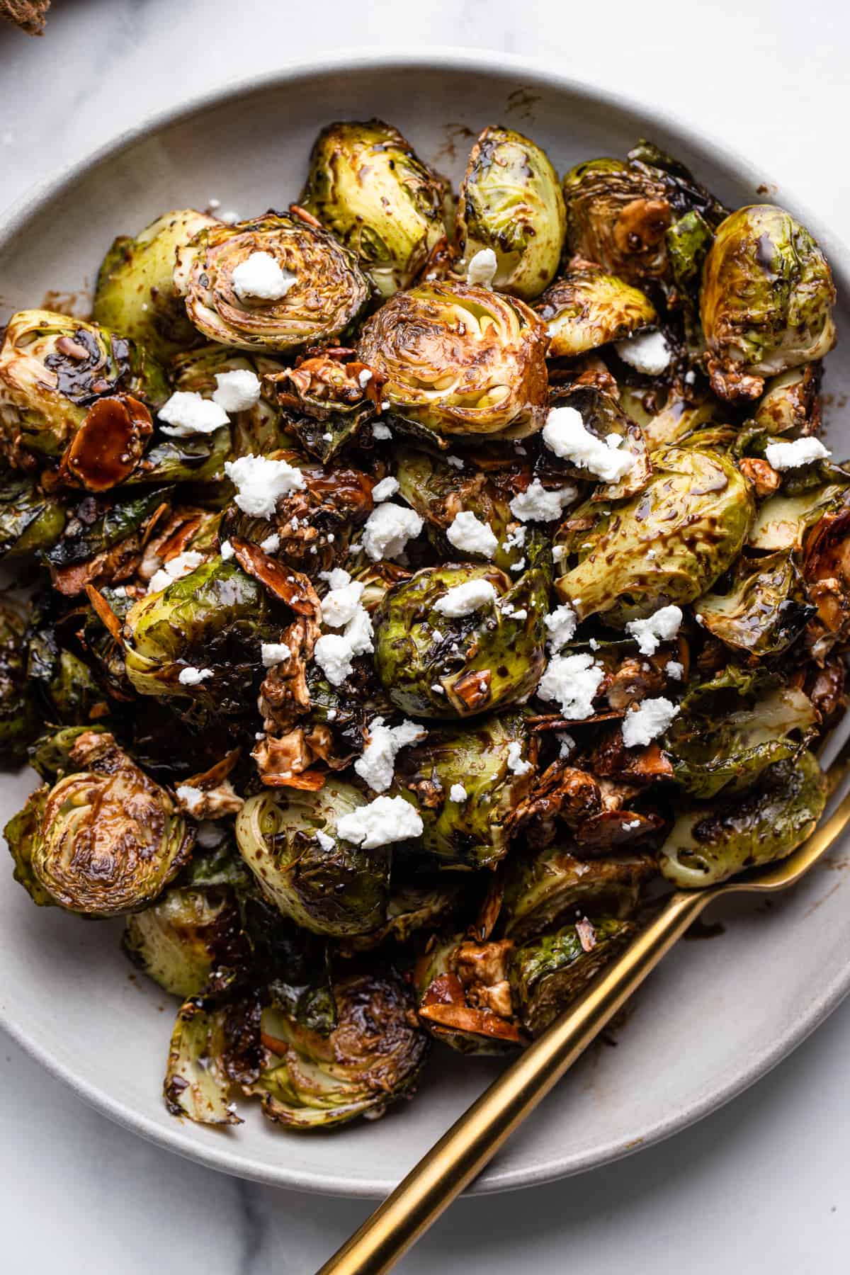 Roasted Balsamic Brussels with toppings and a fork