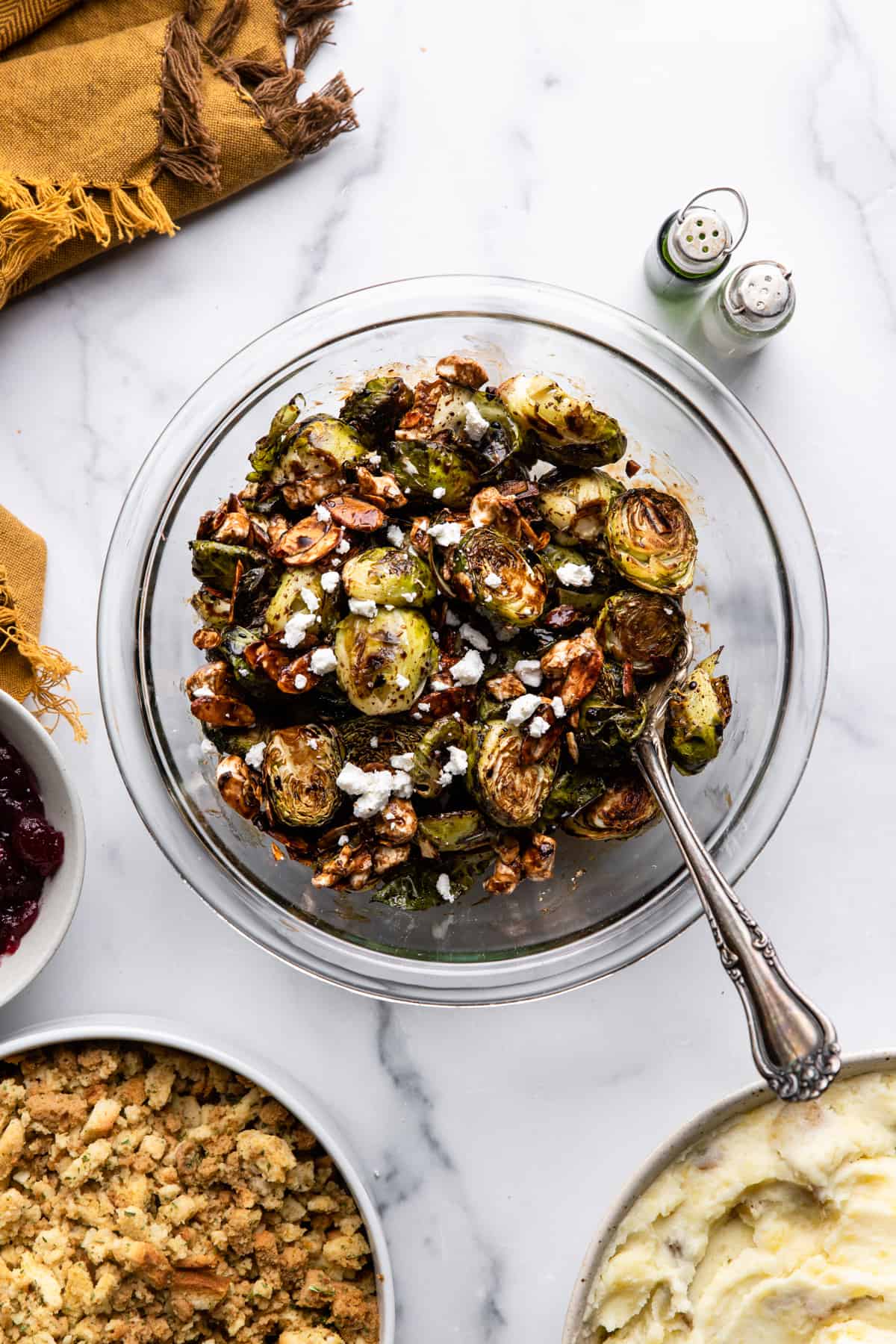a glass bowl full of Roasted Balsamic Brussels