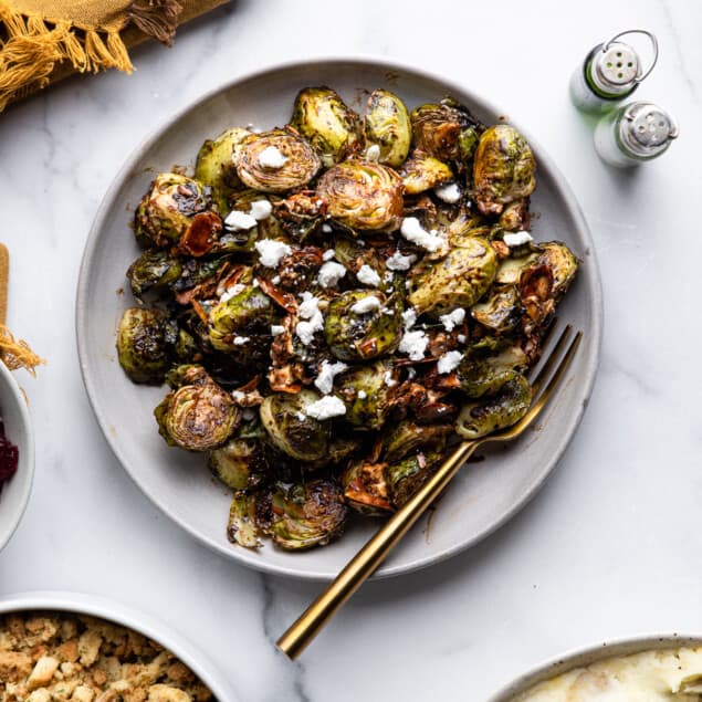 a large plate with Roasted Balsamic Brussels and a fork