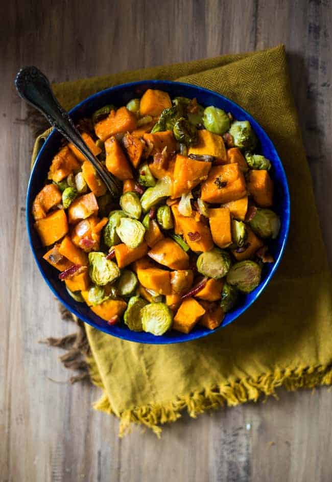 a bowl of the best brussels sprouts with sweet potatoes