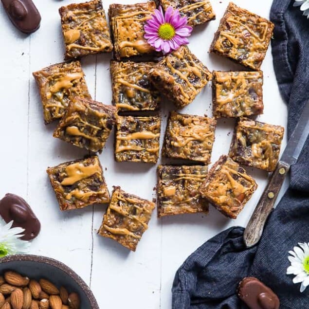 Almond Joy Gluten Free Magic Cookie Bars - These paleo and vegan friendly magic cookie bars taste like an almond joy! They're an easy, healthier spin on a classic treat that you'll never believe is gluten/grain/dairy and refined sugar free! | Foodfaithfitness.com | @FoodFaithFit