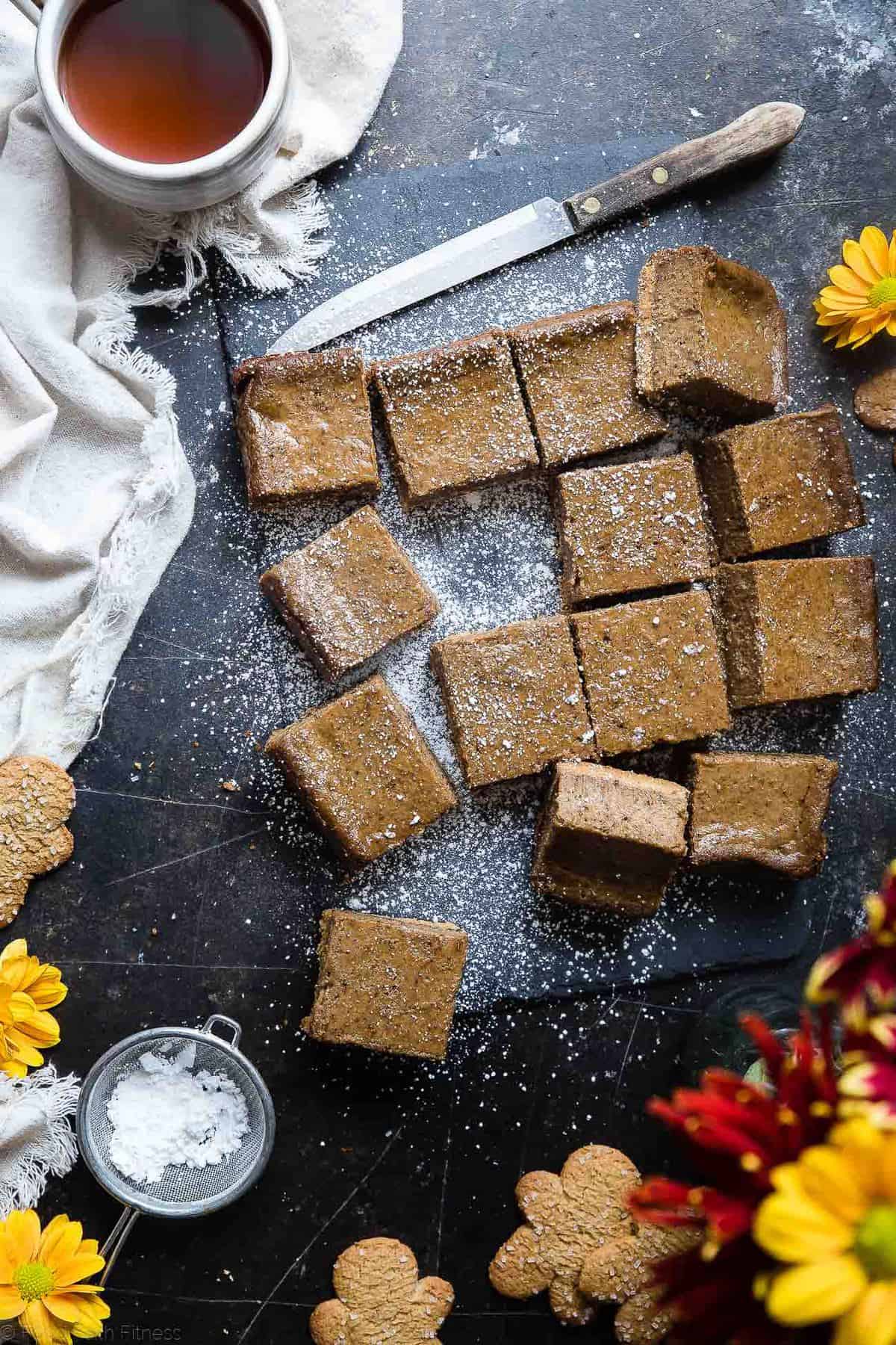 Gingerbread Dairy Free Paleo Cheesecake Bars - These little bites of gingerbread bliss are SO creamy and spicy-sweet! A paleo friendly, healthy and gluten free dessert for the holidays that you will never believe is dairy and egg free!  | Foodfaithfitness.com | @FoodFaithFit