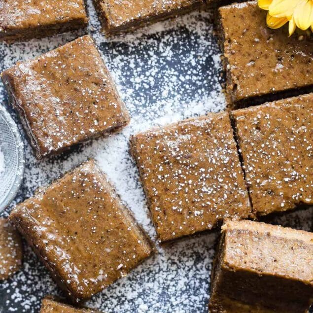 Dairy Free Vegan Coffee Gingerbread Cheesecake Bars - These little bites of gingerbread bliss are SO creamy and spicy-sweet! A paleo friendly, healthy and gluten free dessert for the holidays that you will never believe is dairy and egg free!  | Foodfaithfitness.com | @FoodFaithFit