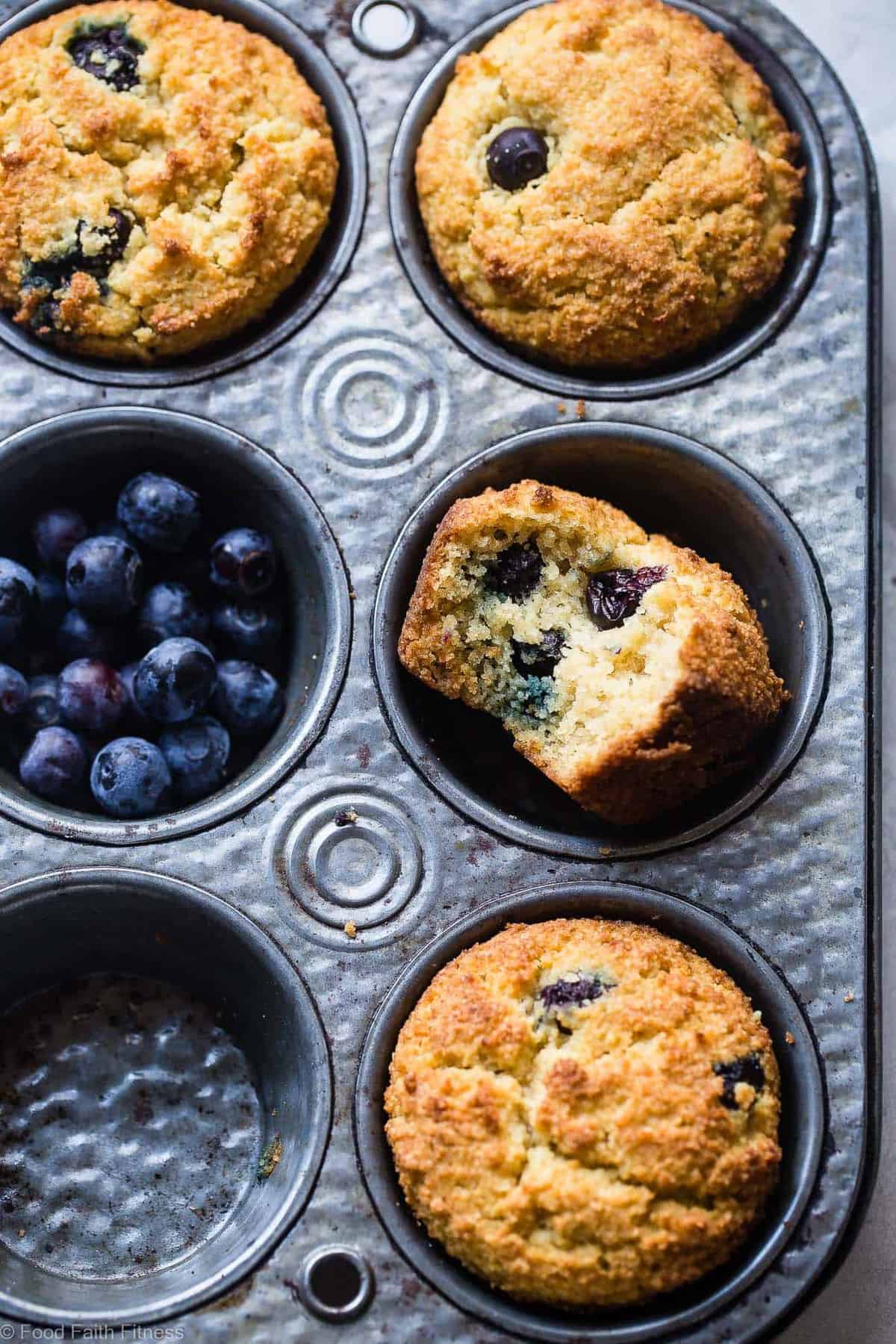 Keto Muffins arranged in a muffin tin with blueberries