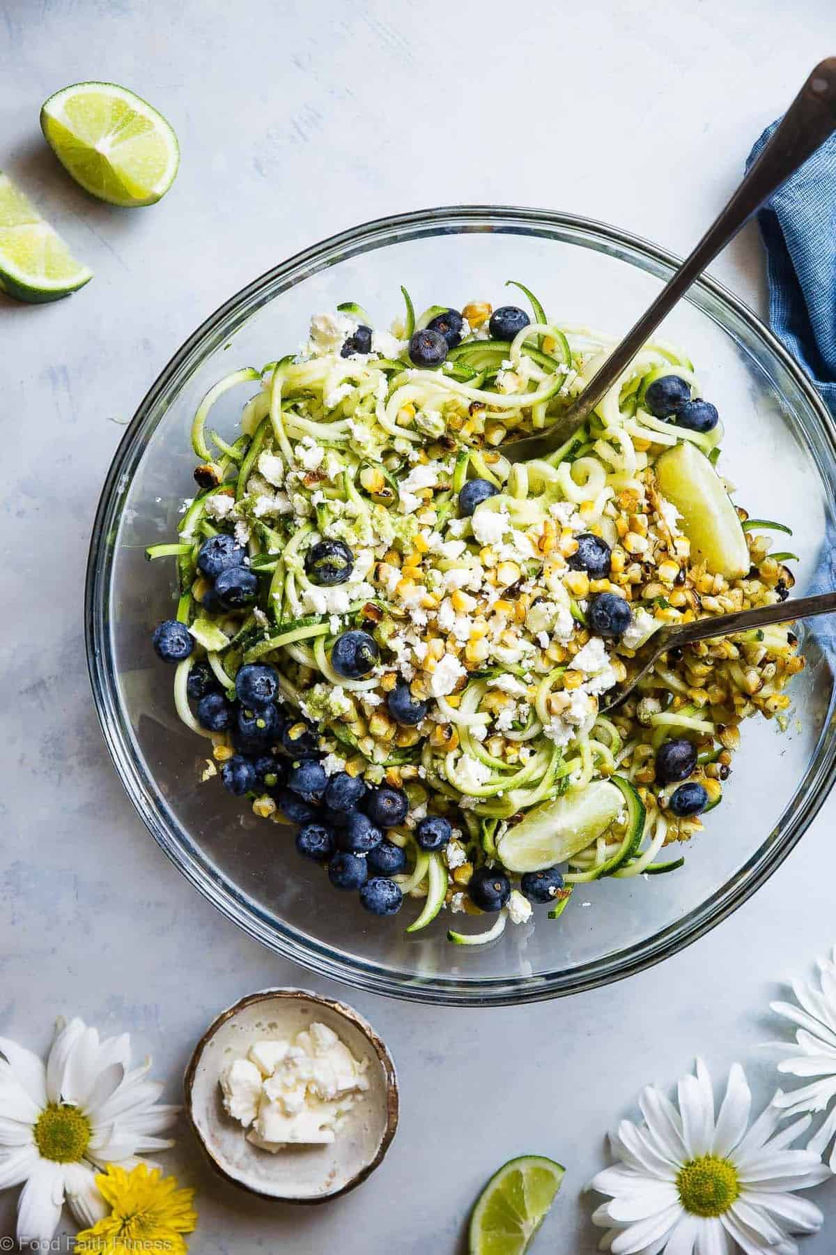 Summer Zucchini Noodle Pasta Salad - This gluten free Zucchini Noodle Pasta Salad is an easy, healthy side dish loaded with smoky grilled corn, sweet blueberries and  a tangy honey lime basil vinaigrette! Perfect for summer potlucks and only 140 calories! | #Foodfaithfitness | #Healthy #Spiralized #Glutenfree #Vegetarian #Salad