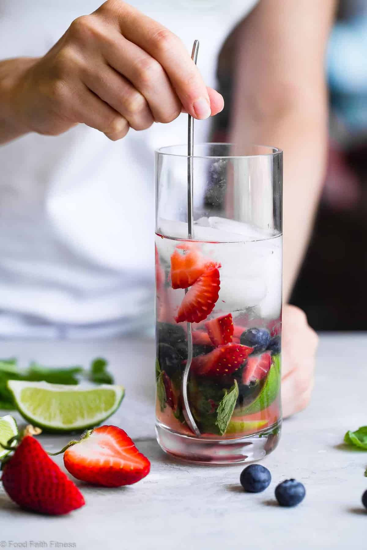 Red White and Blueberry Coconut Mojitos - This strawberry, coconut blueberry mojito recipe is a healthier, gluten free, easy Summer drink with only 130 calories and no sugar! Perfect for July 4th! | #Foodfaithfitness | #Mojito #July4th #Healthy #SugarFree #Glutenfree