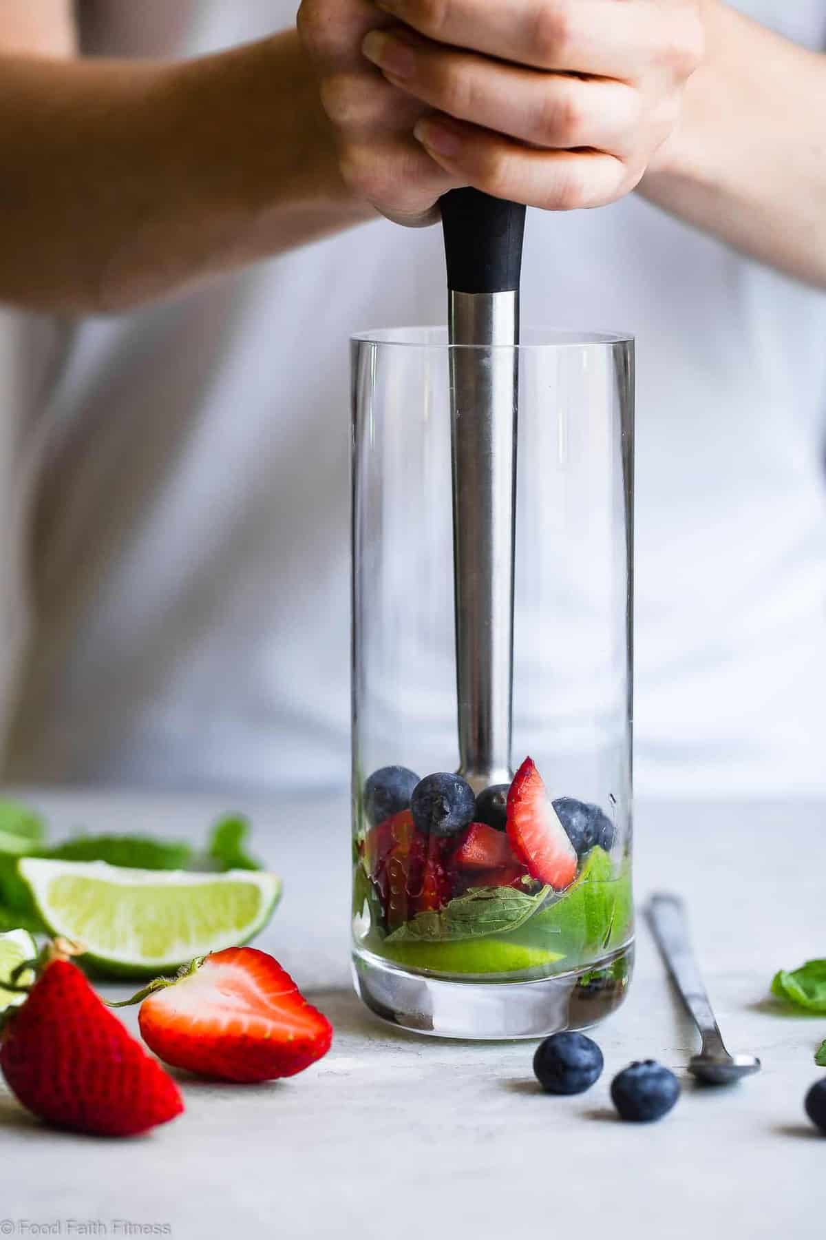 Red White and Blueberry Coconut Mojitos - This coconut blueberry mojito recipe with strawberries is a healthier, gluten free, easy Summer drink with only 130 calories and no sugar! Perfect for July 4th! | #Foodfaithfitness | #Mojito #July4th #Healthy #SugarFree #Glutenfree