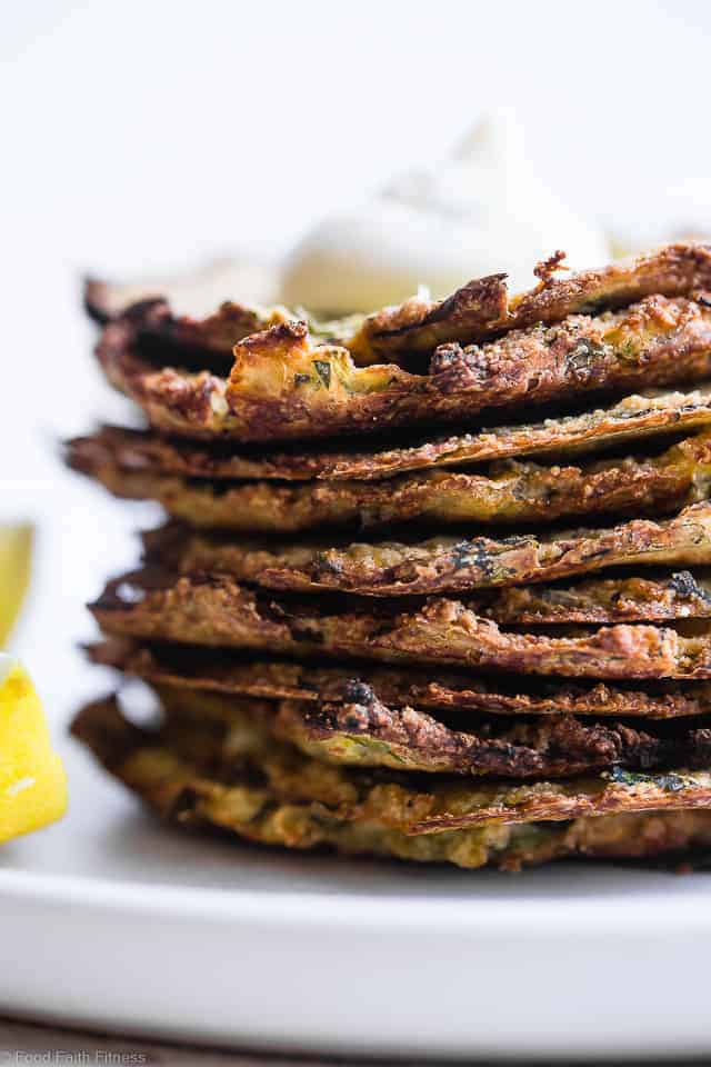 Paleo Baked Zucchini Fritters - These EAS, keto Baked Zucchini Fritters are served with an addicting lemon dill drop and are SO crispy, you'll never believe they're baked not fried! Gluten free, low carb, whole30 and insanely tasty! | #Foodfaithfitness | #Glutenfree #keto #Paleo #Whole30 #Lowcarb