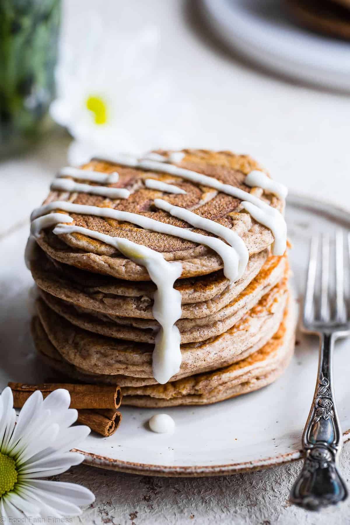 Easy Cinnamon Roll Gluten Free Low Carb Keto Protein Pancakes - This low carb pancake recipe is going to be your new favorite breakfast! Great for kids and adults and packed with 23g of protein! Who doesn't want to wake up to healthy cinnamon rolls?! | #Foodfaithfitness | #Keto #Lowcarb #Glutenfree #Healthy #Pancakes