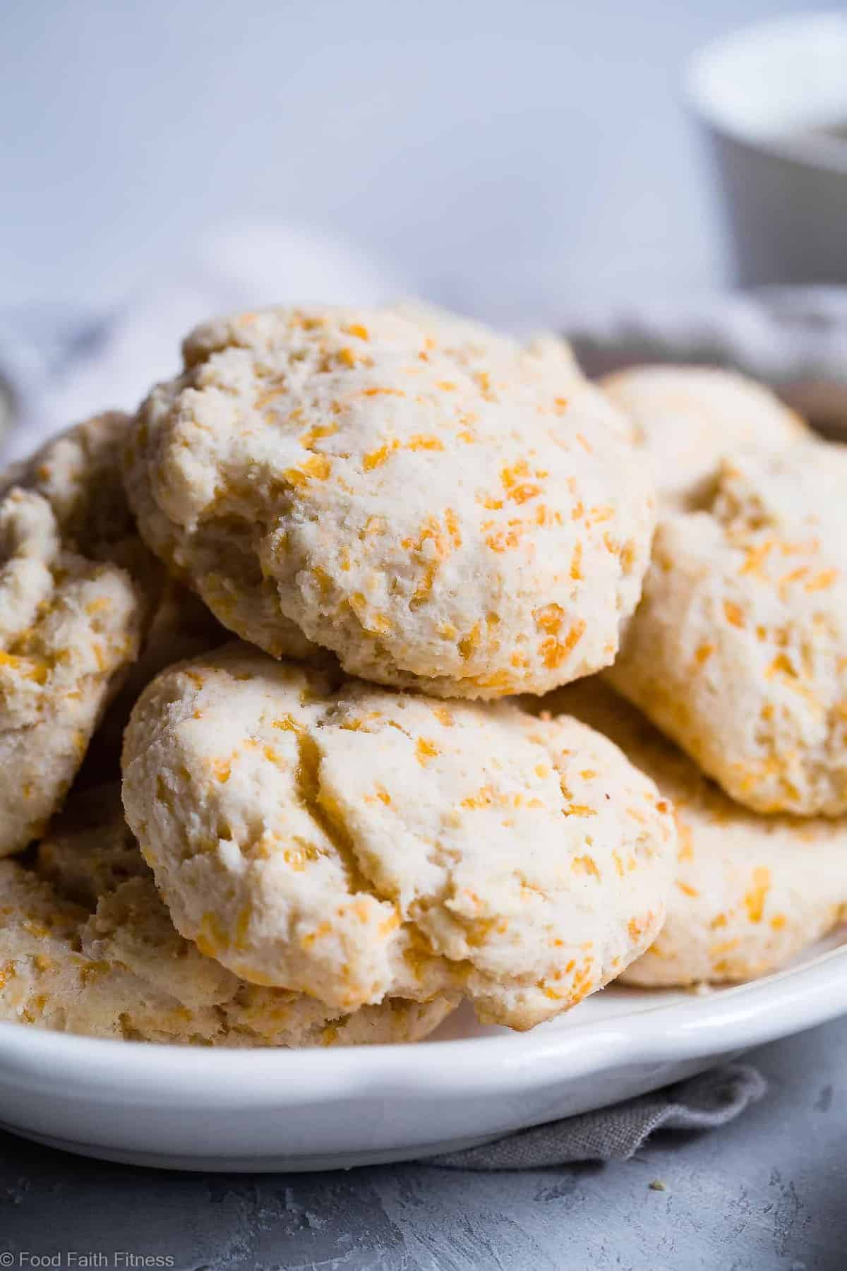 Gluten Free Buttermilk Cheddar Biscuits - These biscuits are SO flaky, soft and buttery that you won't believe how easy they are! These are hands down the BEST gluten free biscuits! | #Foodfaithfitness | #Glutenfree #Healthy #Biscuits #Sugarfree