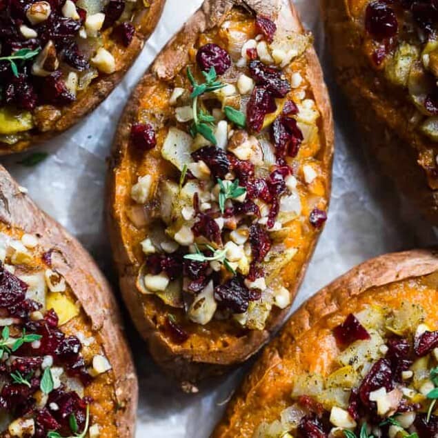 Harvest Paleo Vegan Stuffed Sweet Potatoes - These healthy stuffed sweet potatoes are loaded with cozy, spicy-sweet fall flavors like cranberries, walnuts and pears and are SO easy to make! Gluten, grain and dairy free and whole30 compliant too! | #Foodfaithfitness | #Paleo #Vegan #Glutenfree #Healthy #Whole30