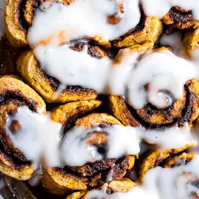 Gluten Free Vegan Pumpkin Cinnamon Rolls - These easy Pumpkin Spice Cinnamon Rolls are so soft and fluffy you won't believe they're gluten, dairy and egg free! Loaded with spicy-sweet fall flavor and SO delicious! | #Foodfaithfitness | #Glutenfree #vegan #dairyfree #eggfree #pumpkin