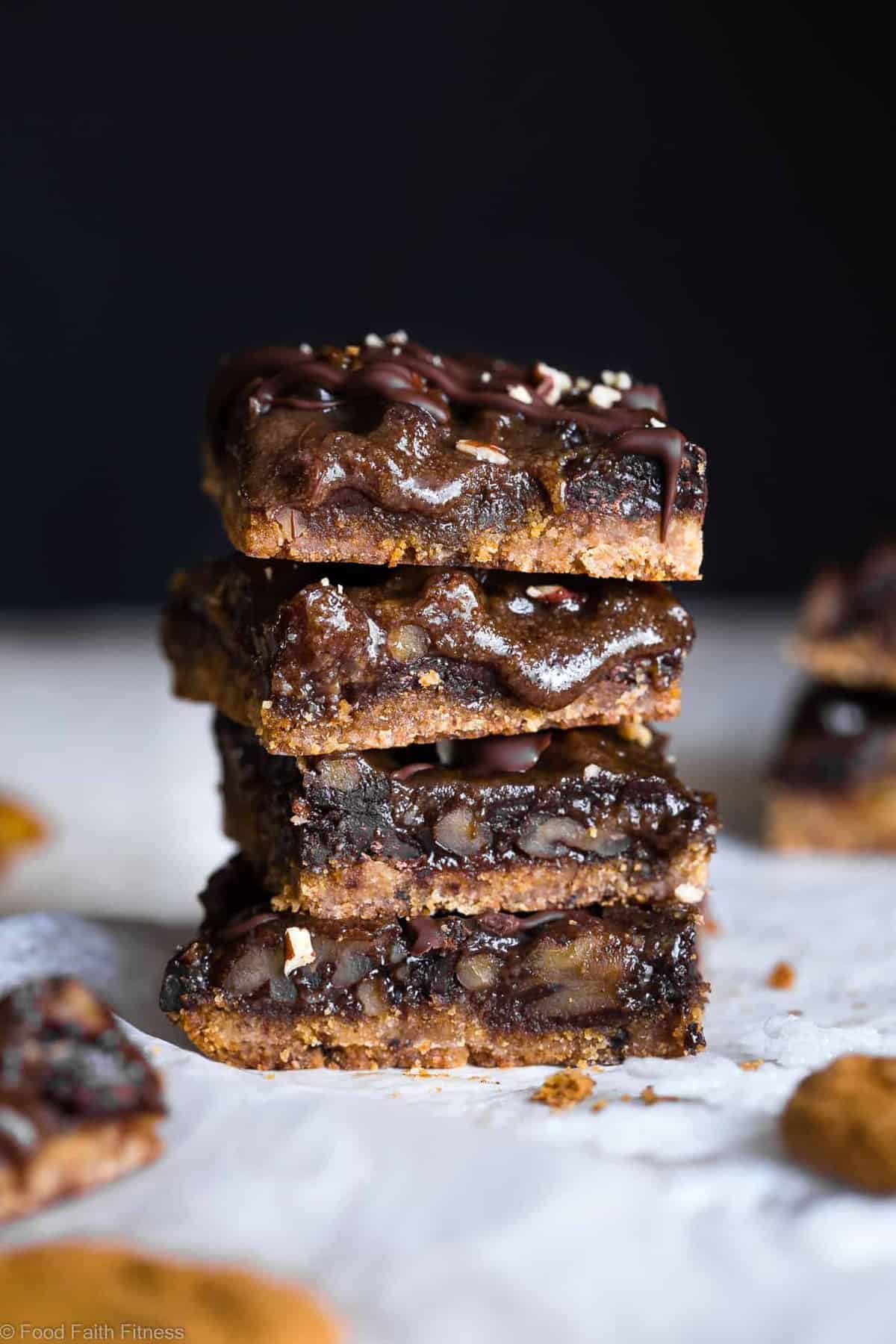 Gingersnap Chocolate Paleo Magic Cookie bars - These OOEY GOOEY, gluten free and vegan magic bars have spicy-sweet, cozy festive flavor and are SO easy to make! Perfect for a healthy, dairy free holiday treat! | #Foodfaithfitness | #Glutenfree #Vegan #Paleo #Dairyfree #Eggfree
