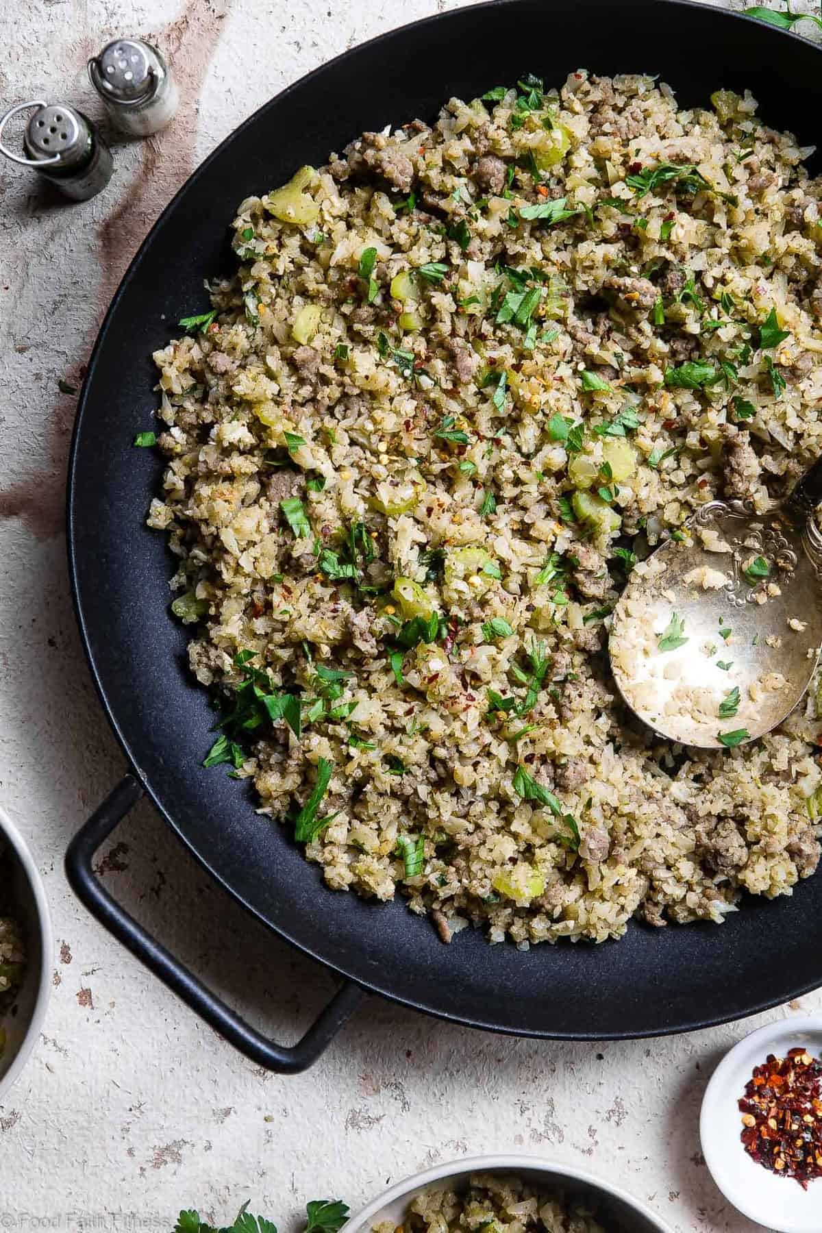 Keto Low Carb Riced Cauliflower Stuffing - This cauliflower rice stuffing is an EASY healthy holiday side that tastes like comfort food, but you won't miss the carbs! Paleo/whole30, only 150 calories and 3 SmartPoints! | #Foodfaithfitness | #Glutenfree #Paleo #Lowcarb #Keto #Whole30
