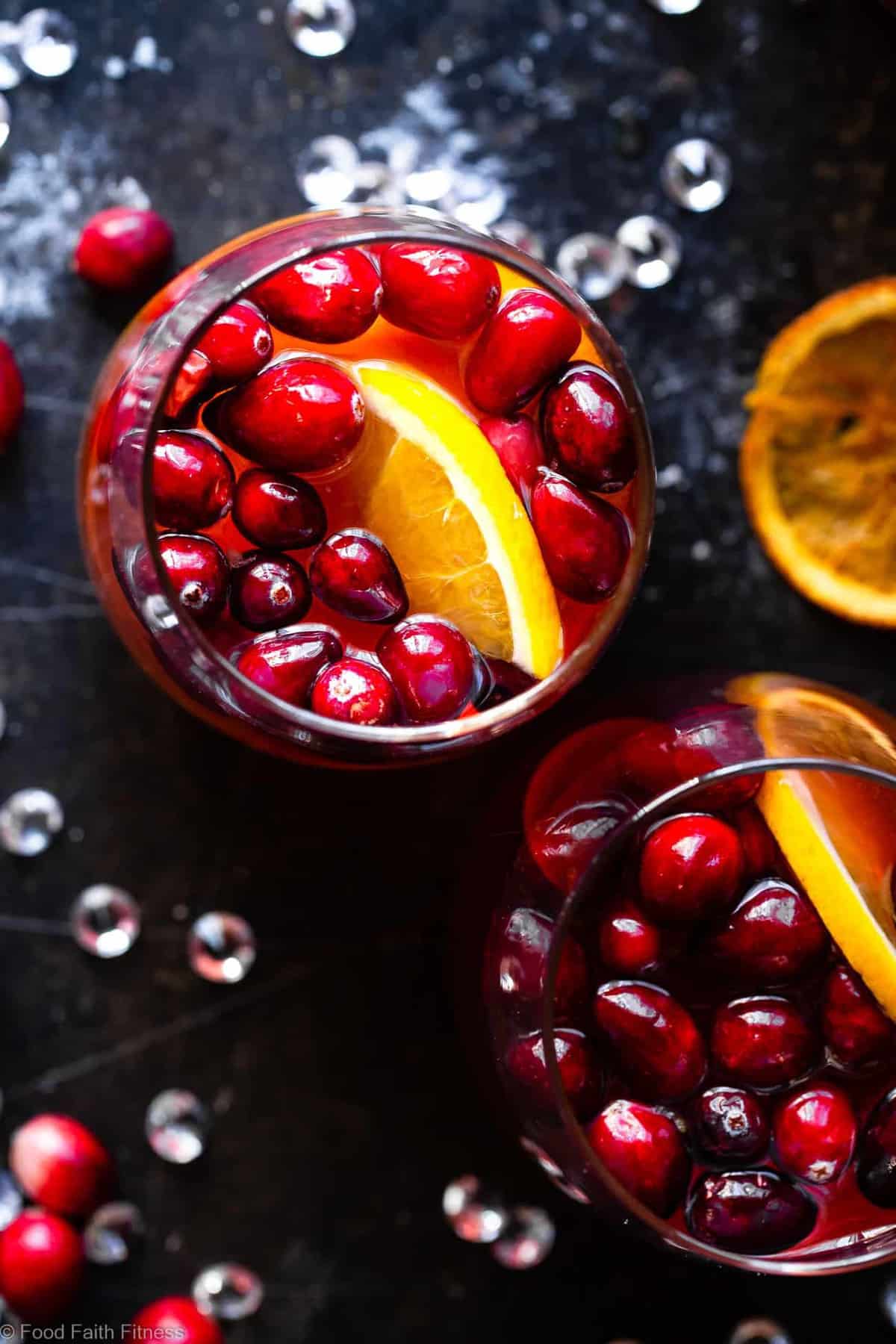 Sparkling Red Sangria - Full of tart cranberries and sweet oranges, this champagne sangria recipe is an easy, better-for-you cocktail that is perfect to serve a crowd this Holiday season! Fizzy, festive and tasty! | #Foodfaithfitness | 
