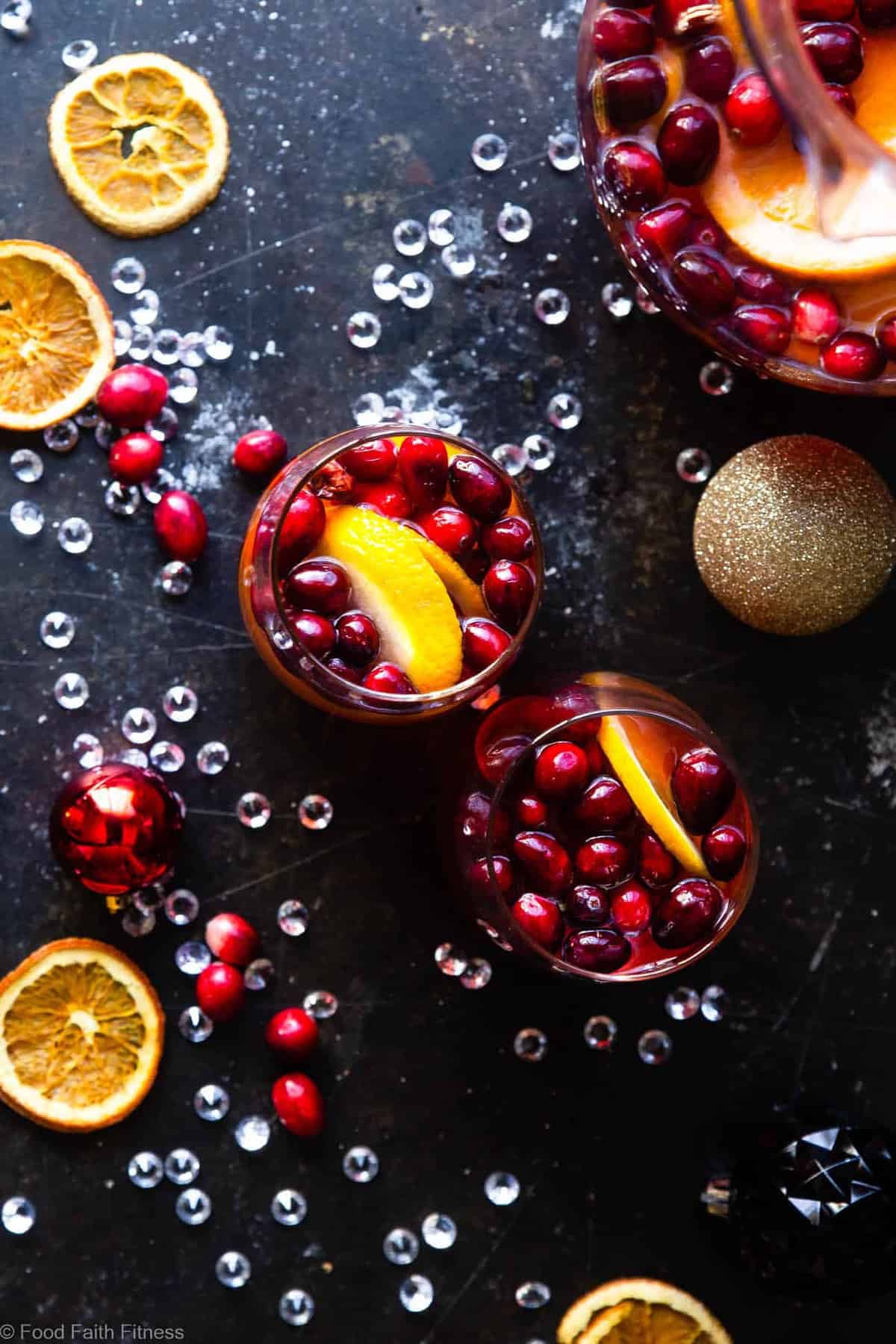 Sparkling Holiday Champagne Sangria - Full of tart cranberries and sweet oranges, this is an easy, better-for-you cocktail that is perfect to serve a crowd this Holiday season! Fizzy, festive and tasty! | #Foodfaithfitness | 