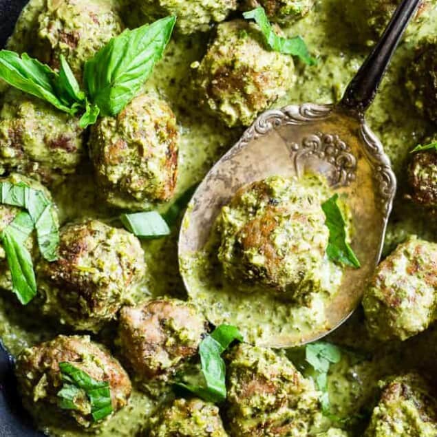 Low Carb Whole30 Turkey Meatballs with Pesto Cream Sauce - These healthy turkey meatballs are simmered in a coconut milk basil pesto cream sauce for an easy, weeknight meal that is keto and paleo friendly and so tasty! | #Foodfaithfitness |