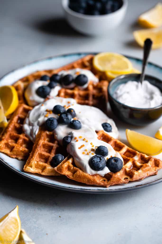Lemon Blueberry Gluten Free Greek Yogurt Waffles - These gluten free waffles are so crispy and fluffy you will never believe they're low fat, oil free, protein packed and only 170 calories! | #Foodfaithfitness |