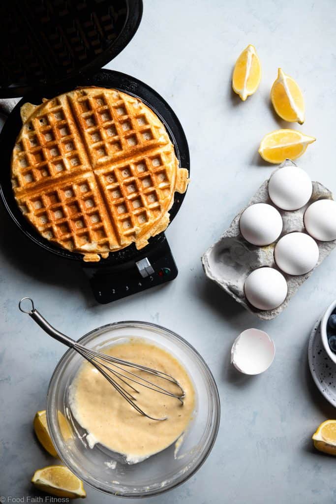 Lemon Blueberry Gluten Free Greek Yogurt Waffles - These gluten free waffles are so crispy and fluffy you will never believe they're low fat, oil free, protein packed and only 170 calories! | #Foodfaithfitness |
