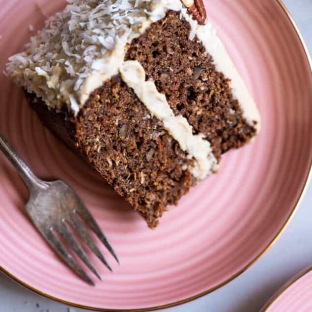 Paleo Carrot Cake - This dairy, grain and gluten free, Paleo Carrot Cake with Almond Flour has a luscious cashew "cream cheese" frosting and is easy to make! Always a hit with a crowd! | #Foodfaithfitness | #Glutenfree #Carrotcake #Paleo #Dairyfree #Healthy