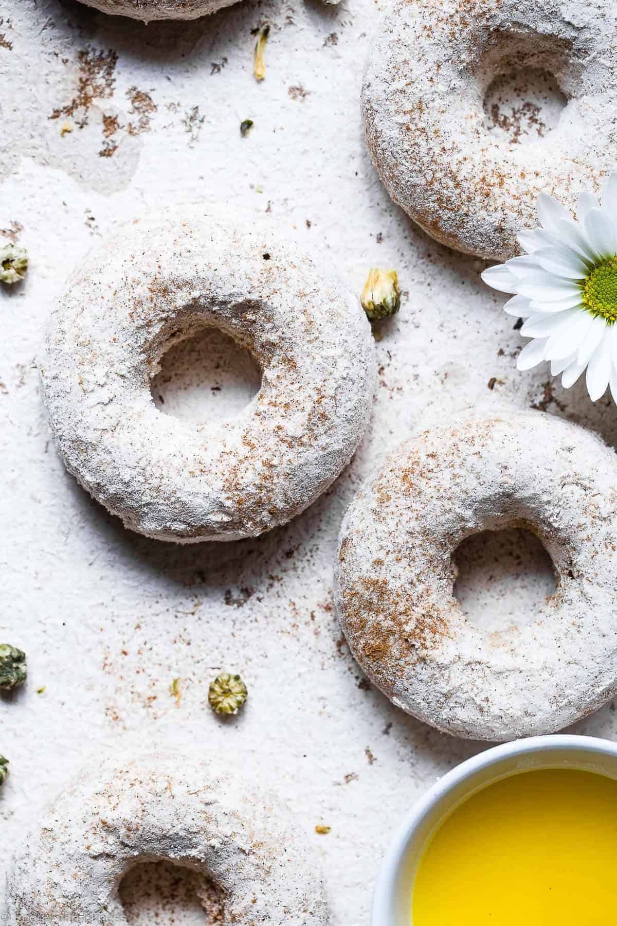 Cinnamon Baked Protein Donuts - This gluten free Healthy Protein Donuts Recipe is soft, fluffy and secretly protein packed! A perfect treat to curb your sweet tooth, and a dairy-free option is included! Great for kids and adults! | #Glutenfree #Dairyfree #Healthy #Donuts #Dessert