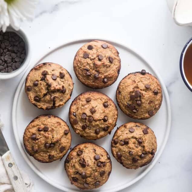 Healthy Zucchini Bread Muffins - These dairy free Zucchini Muffins are fluffy and gluten, dairy, oil and sugar free! Sweetened with dates, studded with chocolate chips and only 170 calories! Great for kids and adults! | #Foodfaithfitness |