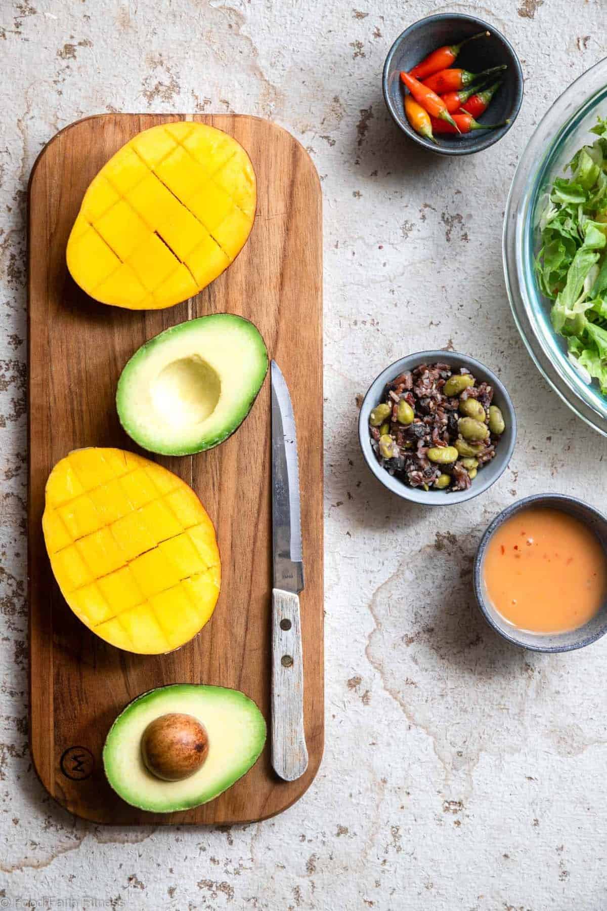 Mangoes and avocado on a cutting board to make Thai beef salad recipe